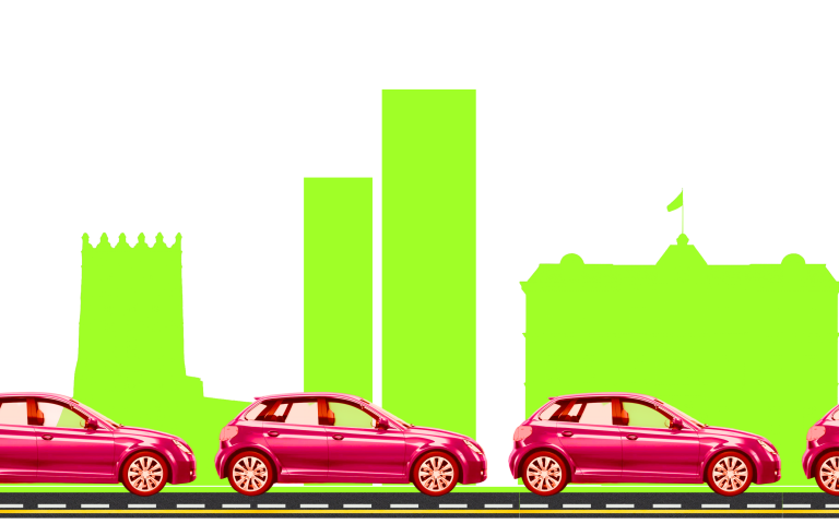 червоні машини на фоні зелених будинків